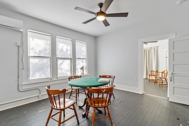 dining area featuring ceiling fan, dark wood-type flooring, and a wall unit AC