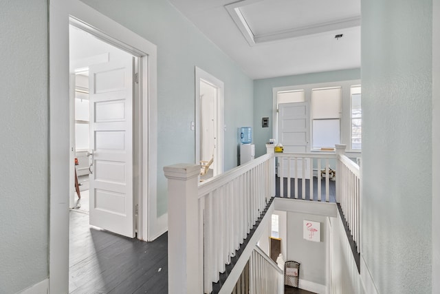 hall with dark hardwood / wood-style floors