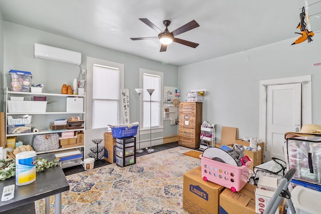 game room featuring ceiling fan and a wall mounted air conditioner