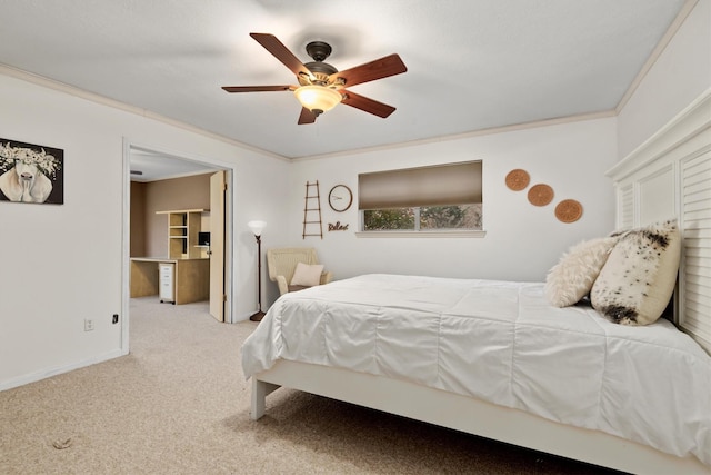 carpeted bedroom with ceiling fan and crown molding