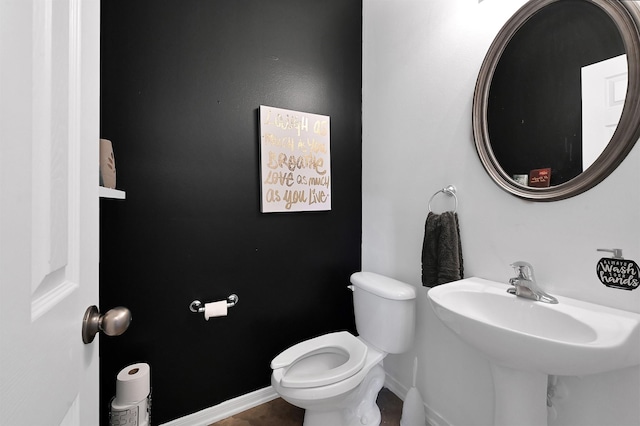 bathroom with sink and toilet