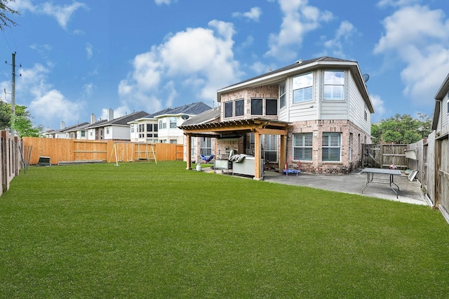 back of property featuring a patio and a yard