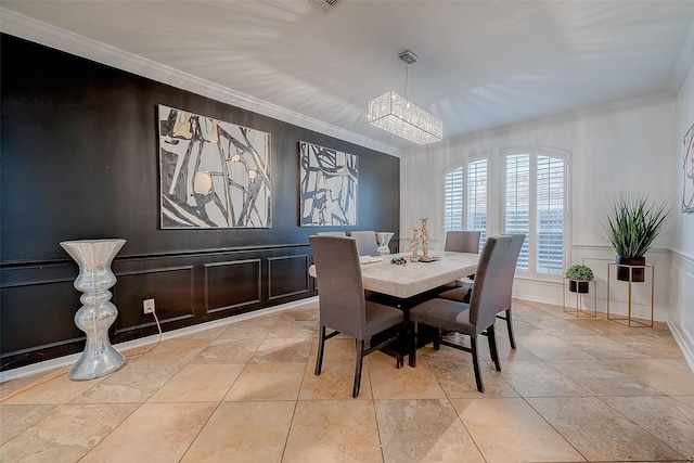 tiled dining room featuring a notable chandelier and ornamental molding