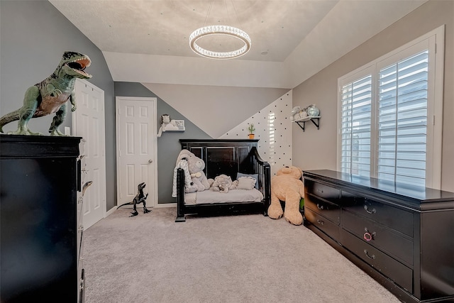 bedroom featuring carpet and lofted ceiling