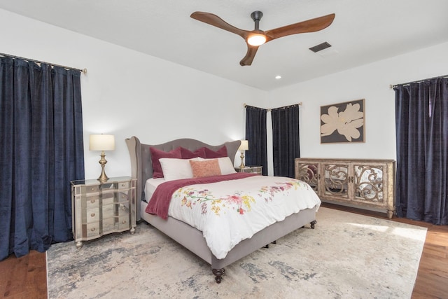 bedroom with hardwood / wood-style flooring and ceiling fan