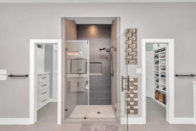 bathroom featuring walk in shower and tile patterned floors