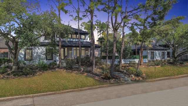 view of front of home with a yard