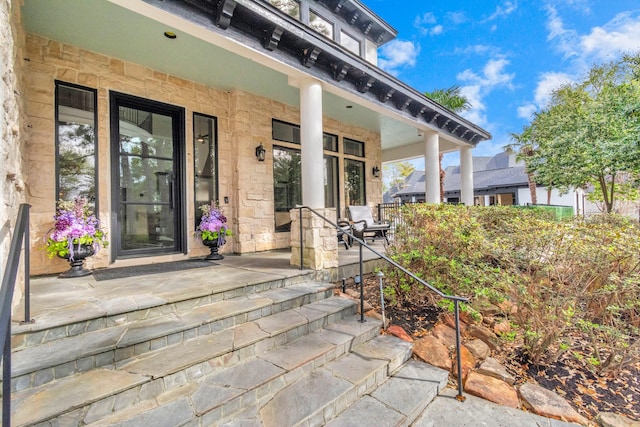 entrance to property featuring a porch