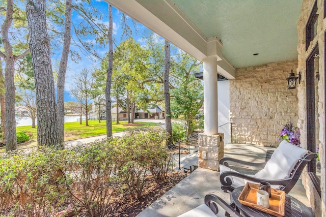 view of patio featuring a water view