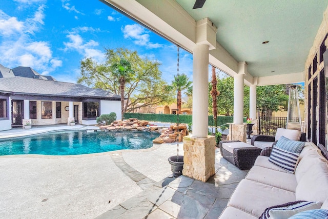 view of pool featuring ceiling fan and a patio