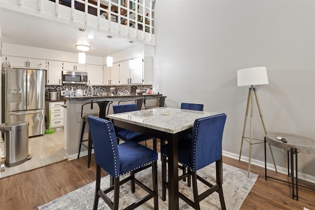 dining area with hardwood / wood-style floors