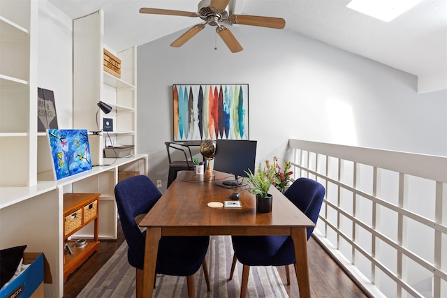 office space featuring ceiling fan, vaulted ceiling, and dark hardwood / wood-style floors