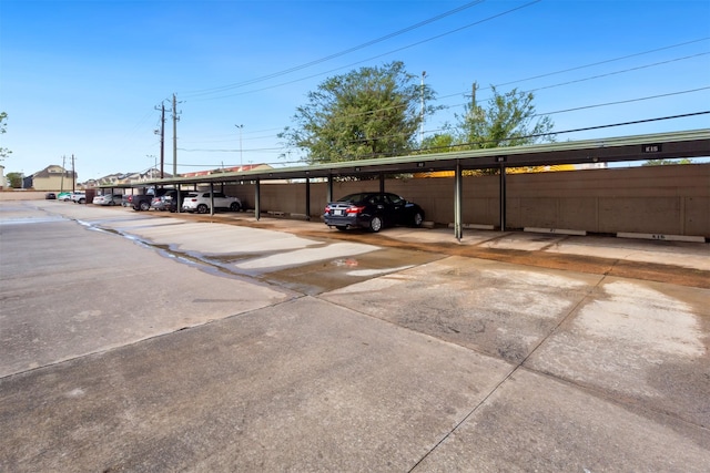 view of vehicle parking featuring a carport