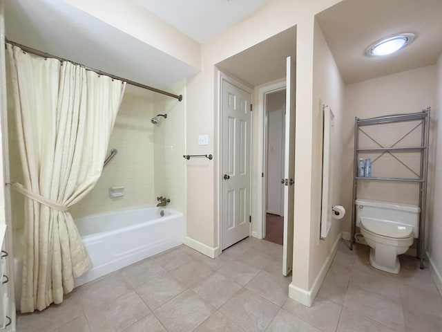 bathroom featuring toilet, tile patterned floors, and shower / bath combo