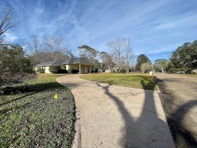 view of home's exterior featuring a lawn