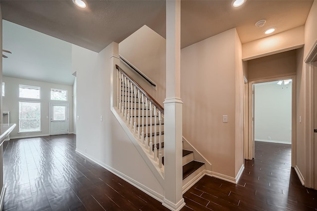 stairs featuring recessed lighting, baseboards, and wood finished floors