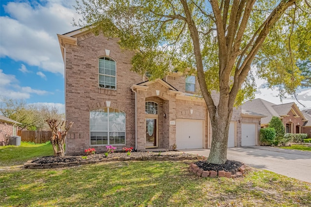 view of front of property with a front yard, fence, concrete driveway, a garage, and brick siding