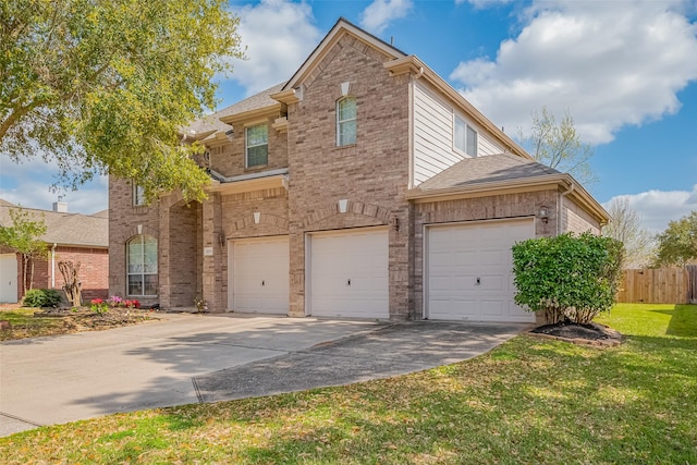 traditional-style house with a front lawn, fence, concrete driveway, an attached garage, and brick siding