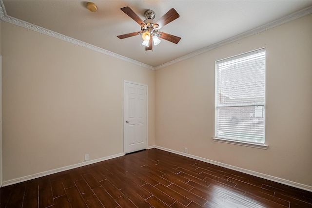 unfurnished room featuring a wealth of natural light, dark wood-style floors, baseboards, and ornamental molding