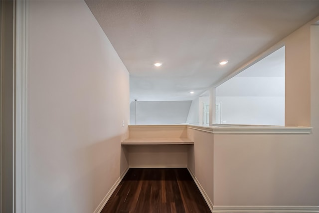 hallway featuring recessed lighting, baseboards, and dark wood-style flooring