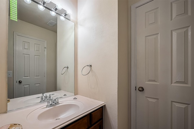 bathroom with visible vents and vanity