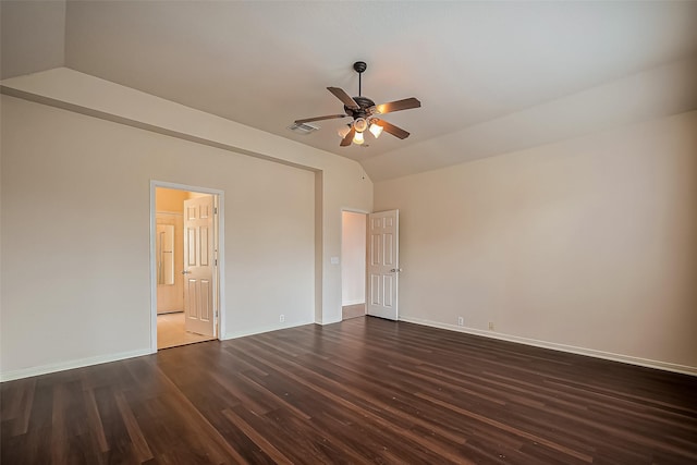 unfurnished bedroom with lofted ceiling, baseboards, visible vents, and dark wood-style flooring