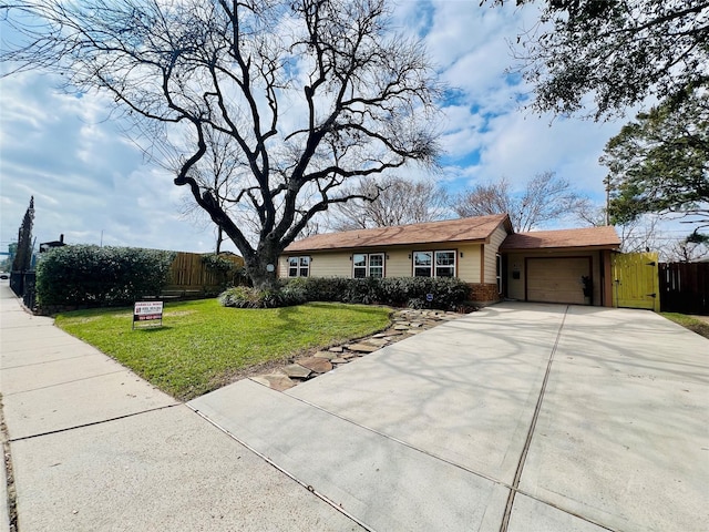 single story home featuring a garage and a front yard