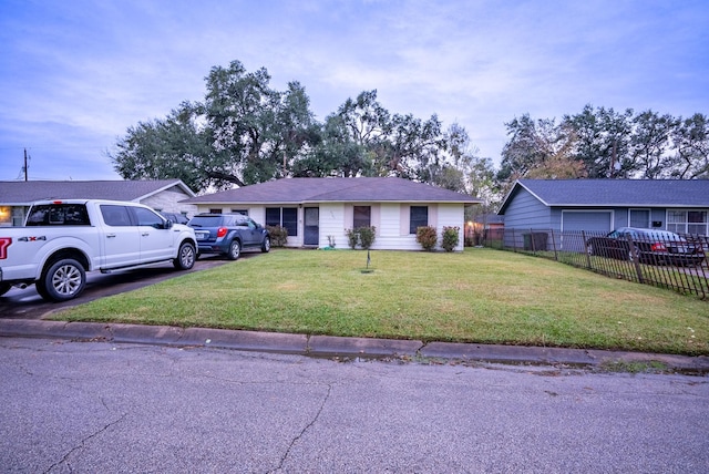 ranch-style house with a front lawn