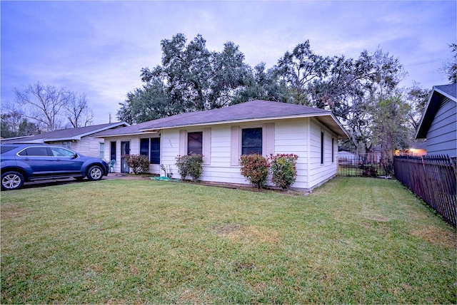 ranch-style house with a front lawn