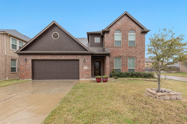 view of front facade featuring a front yard and a garage