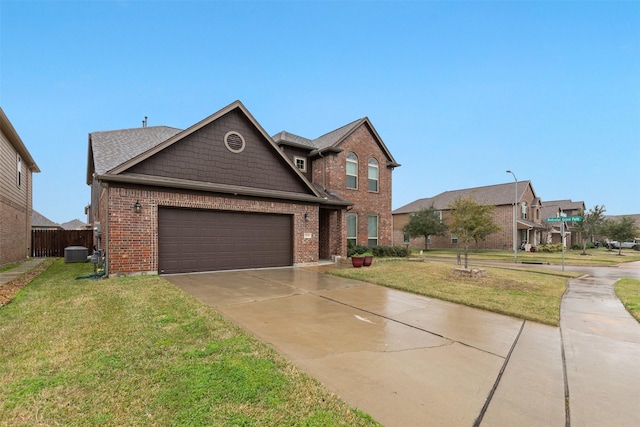 view of front of property with a front yard, a garage, and cooling unit