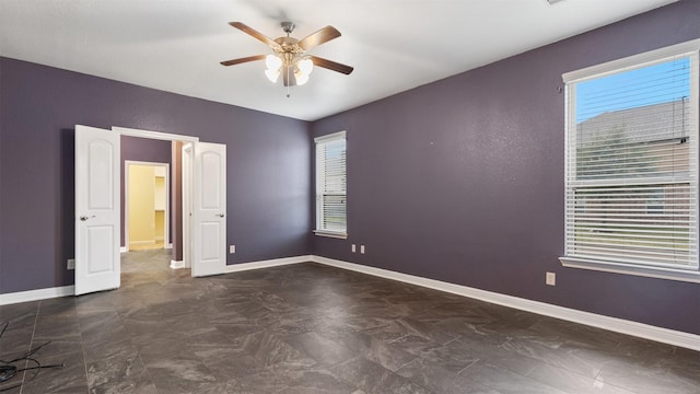 empty room featuring ceiling fan