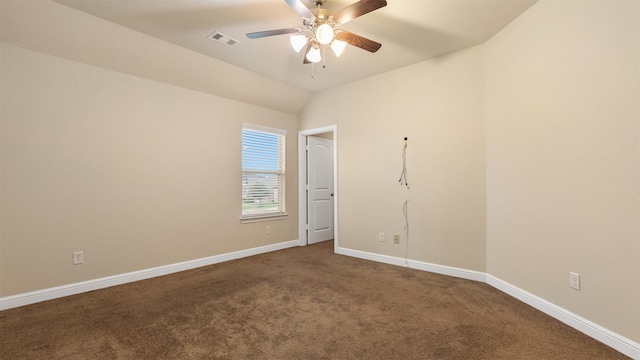 carpeted empty room featuring lofted ceiling and ceiling fan