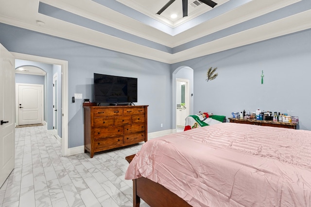 bedroom featuring ceiling fan, crown molding, and a raised ceiling