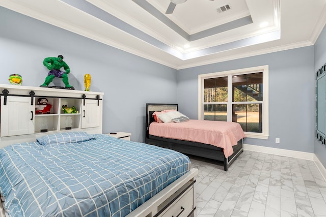 bedroom featuring ceiling fan, a barn door, crown molding, and a raised ceiling