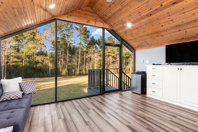 unfurnished sunroom with vaulted ceiling and wood ceiling