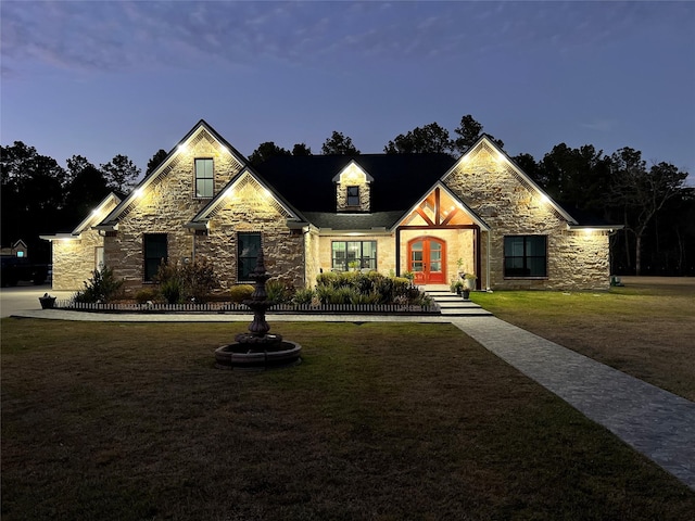 view of front of property with a yard