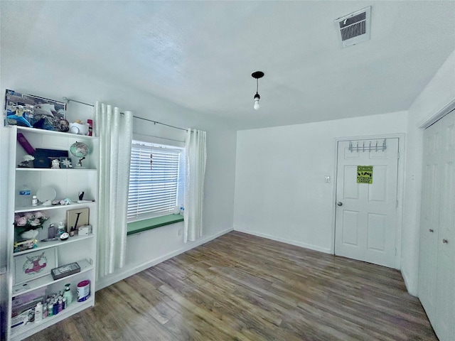 spare room featuring hardwood / wood-style flooring