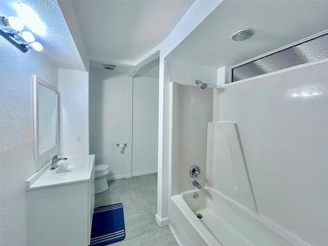 full bathroom with toilet, vanity, a textured ceiling, and shower / tub combination