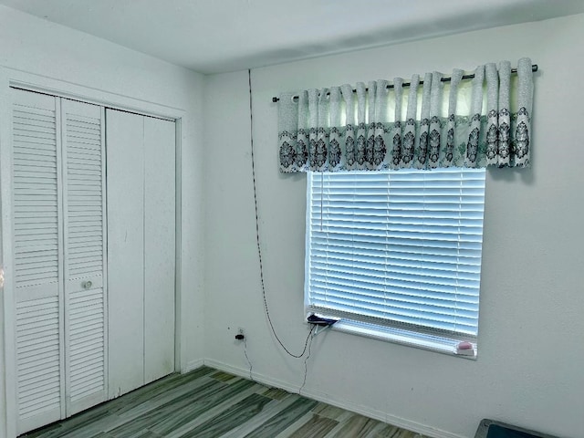 interior space with a closet and light hardwood / wood-style floors