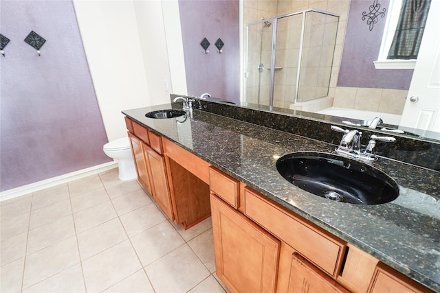 full bathroom featuring separate shower and tub, vanity, tile patterned floors, and toilet