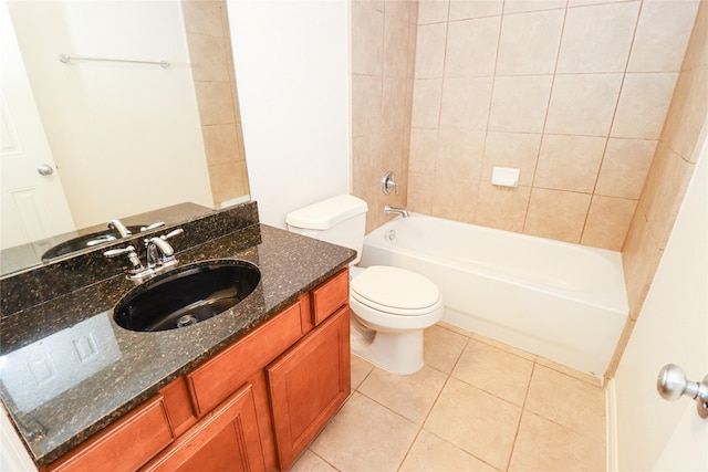 full bathroom with toilet, vanity, tile patterned floors, and tiled shower / bath combo