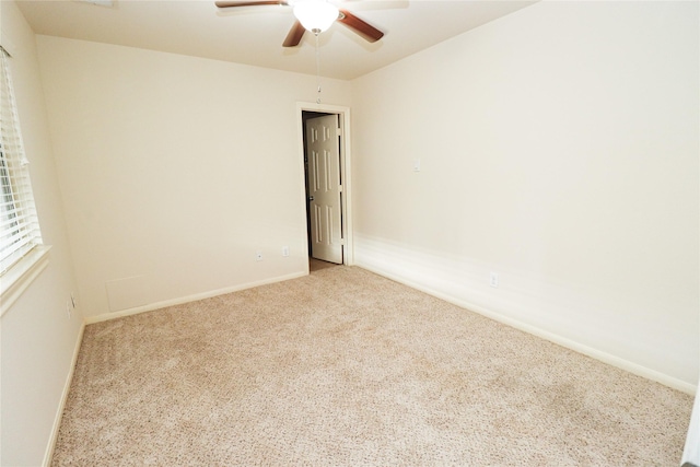 carpeted empty room with ceiling fan