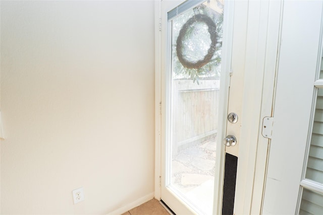 doorway to outside featuring light tile patterned floors