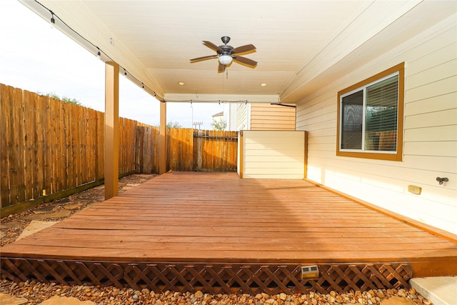 wooden terrace featuring ceiling fan