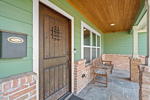 doorway to property featuring a porch