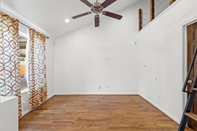 unfurnished room featuring ceiling fan, vaulted ceiling, and wood-type flooring