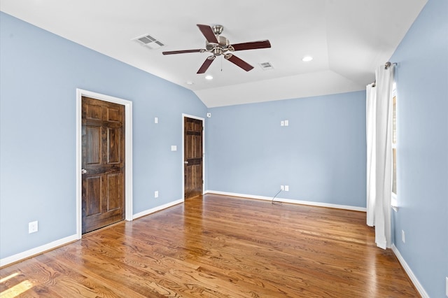 unfurnished bedroom featuring wood-type flooring, ceiling fan, and vaulted ceiling