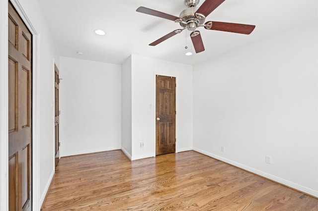 empty room featuring ceiling fan and light wood-type flooring