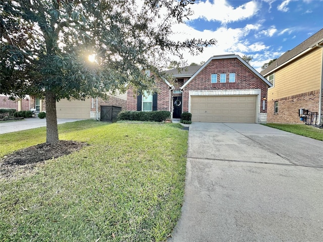 view of front of home with a garage and a front lawn